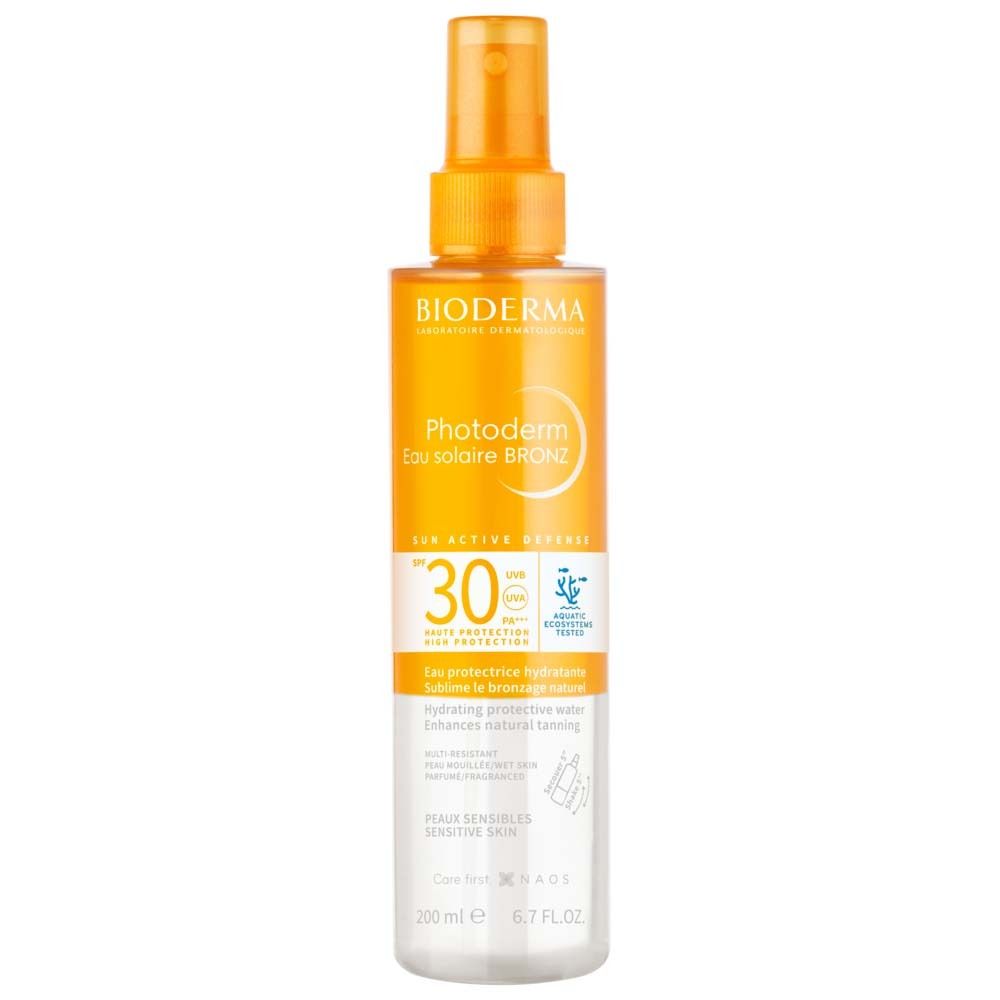 BIODERMA Photoderm Eau solaire BRONZ SPF30. Sprayflasche, orange-weiß. Enthält Text und SPF30.