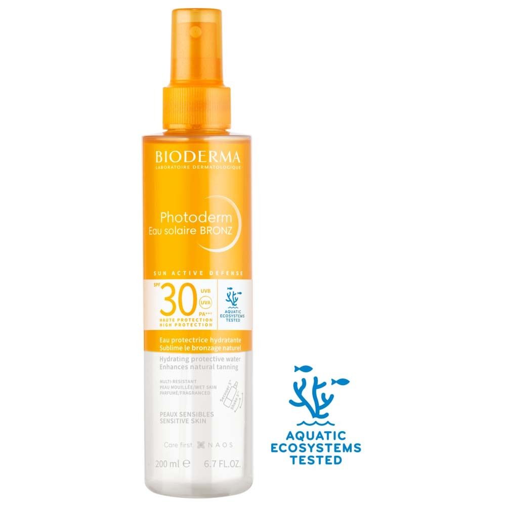 BIODERMA Photoderm Eau solaire BRONZ SPF30. Sprayflasche, orange-weiß. Mit Text und SPF30. Aquatische Ökosysteme getestet.