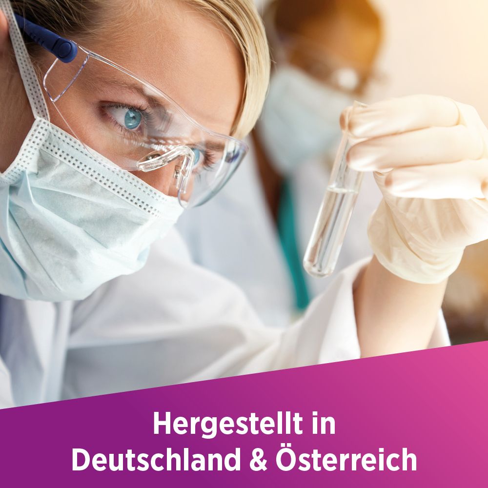 Wissenschaftlerin mit Reagenzglas. Text: Hergestellt in Deutschland & Österreich.