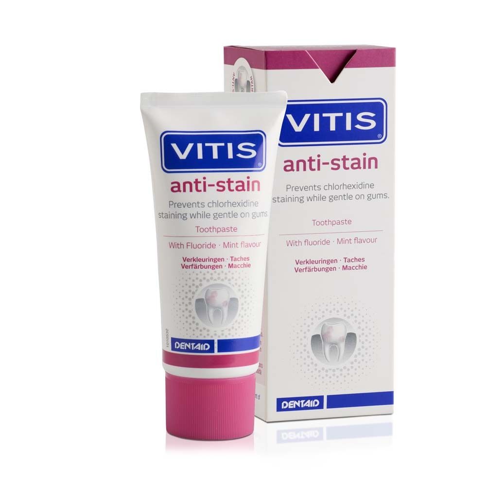 Zahnpasta-Tube und -Verpackung. Weiß, pink und blau. Aufschrift: VITIS anti-stain. Verhindert Verfärbungen.