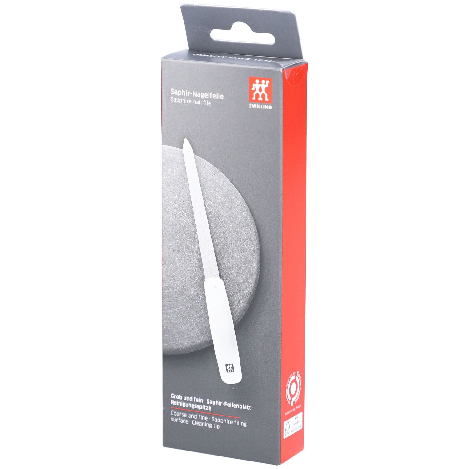 Verpackung der ZWILLING Saphir-Nagelfeile. Weißer Griff, graue Feilfläche. Aufschrift: Saphir-Nagelfeile, ZWILLING Logo. Grob und fein.