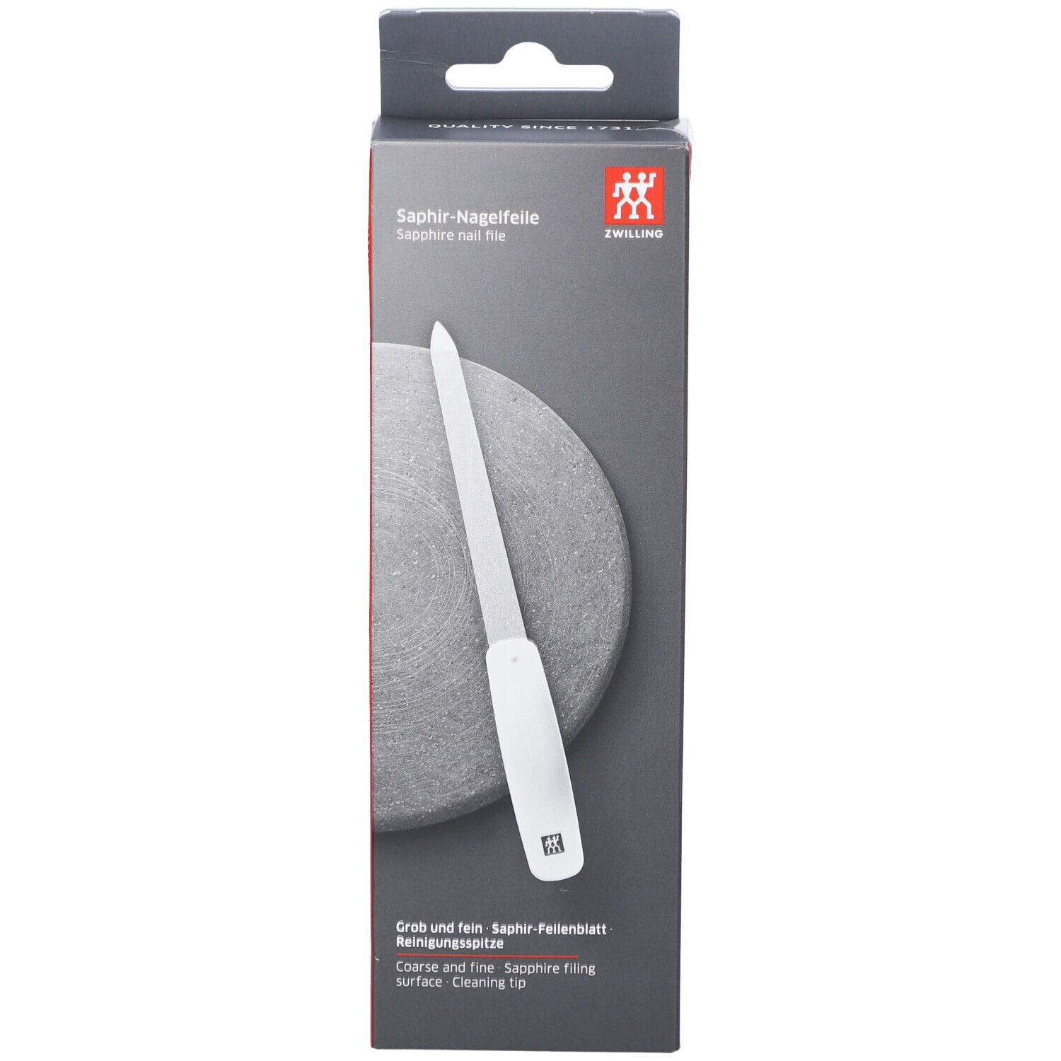 Verpackung der ZWILLING Saphir-Nagelfeile. Weißer Griff, graue Feilfläche. Aufschrift: Saphir-Nagelfeile, ZWILLING Logo. Grob und fein.