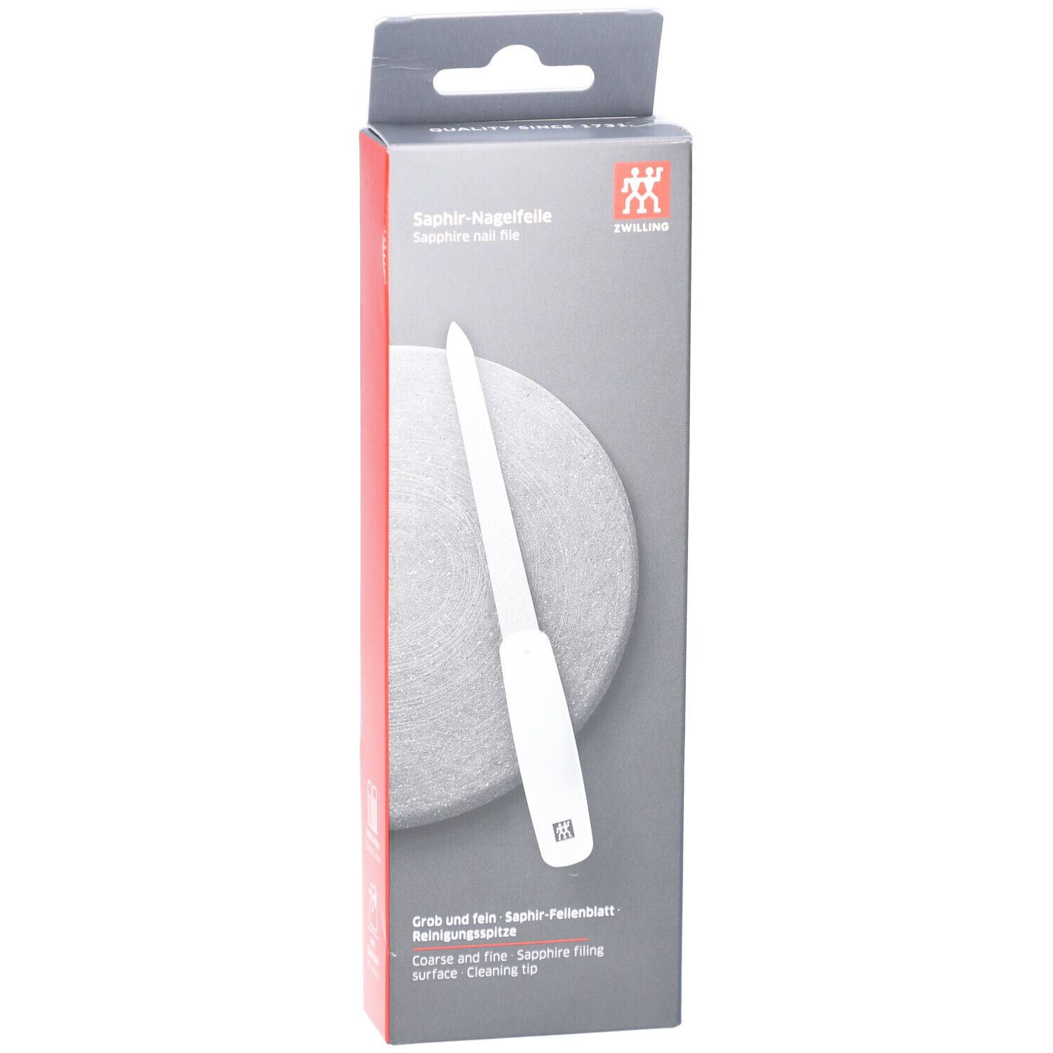 Verpackung der ZWILLING Saphir-Nagelfeile. Weißer Griff, graue Feilfläche. Aufschrift: Saphir-Nagelfeile, ZWILLING Logo. Grob und fein.