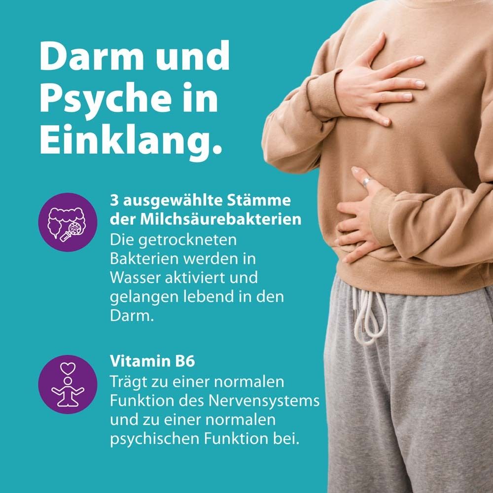 Text: Darm und Psyche in Einklang. Frau hält sich den Bauch. Vitamin B6. Trägt zur normalen Funktion des Nervensystems bei.