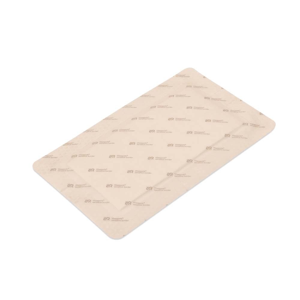 Wundverband Vliwasorb sensitive border. Rechteckige Form, beige. Zeigt die Oberfläche des Verbands. Keine Verpackung.