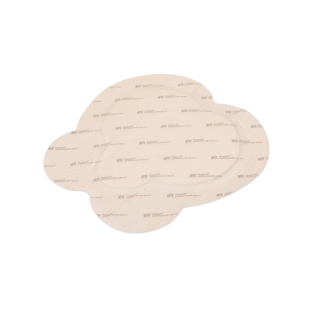 Wundverband Vliwasorb sensitive border, Form sacrum. Beige, mit Silikon und Haftrand.