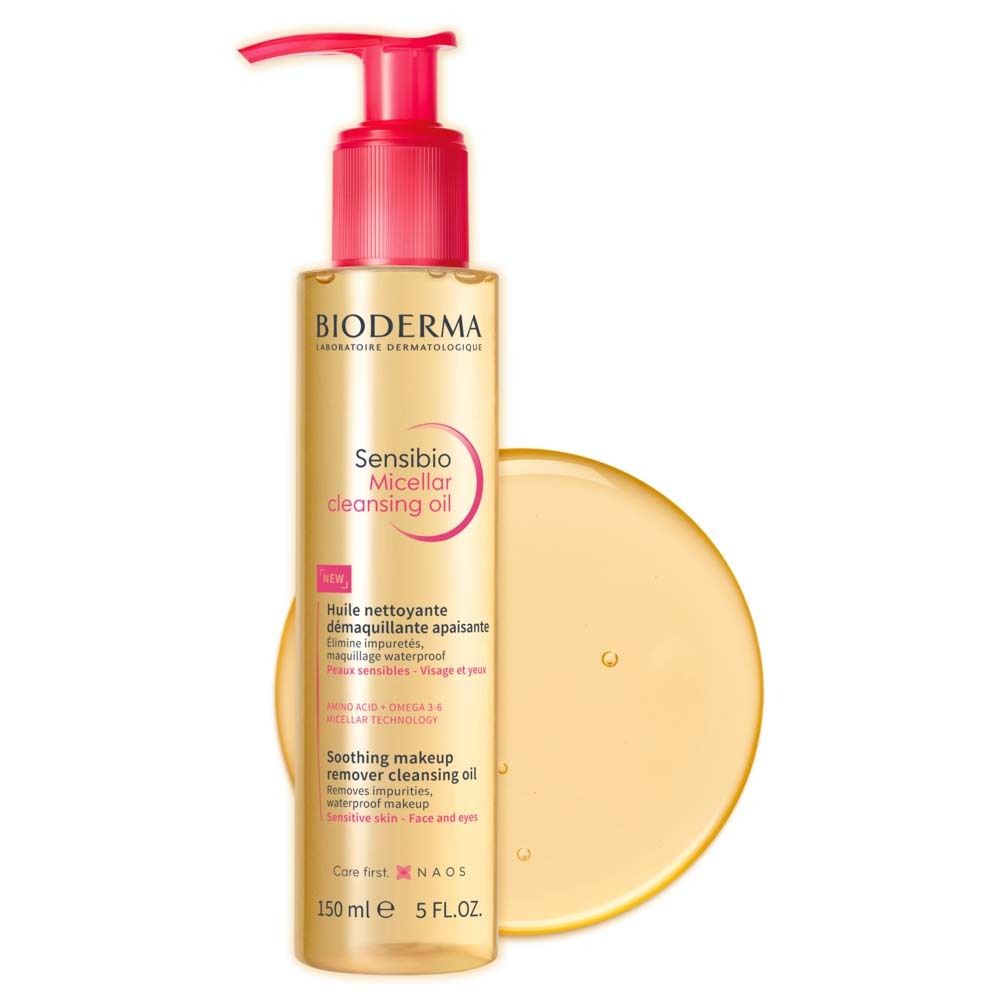 BIODERMA Sensibio Mizellenreinigungsöl Flasche mit gelbem Öl-Klecks. Rosa Pumpe. Text: Sensibio, Micellar cleansing oil.
