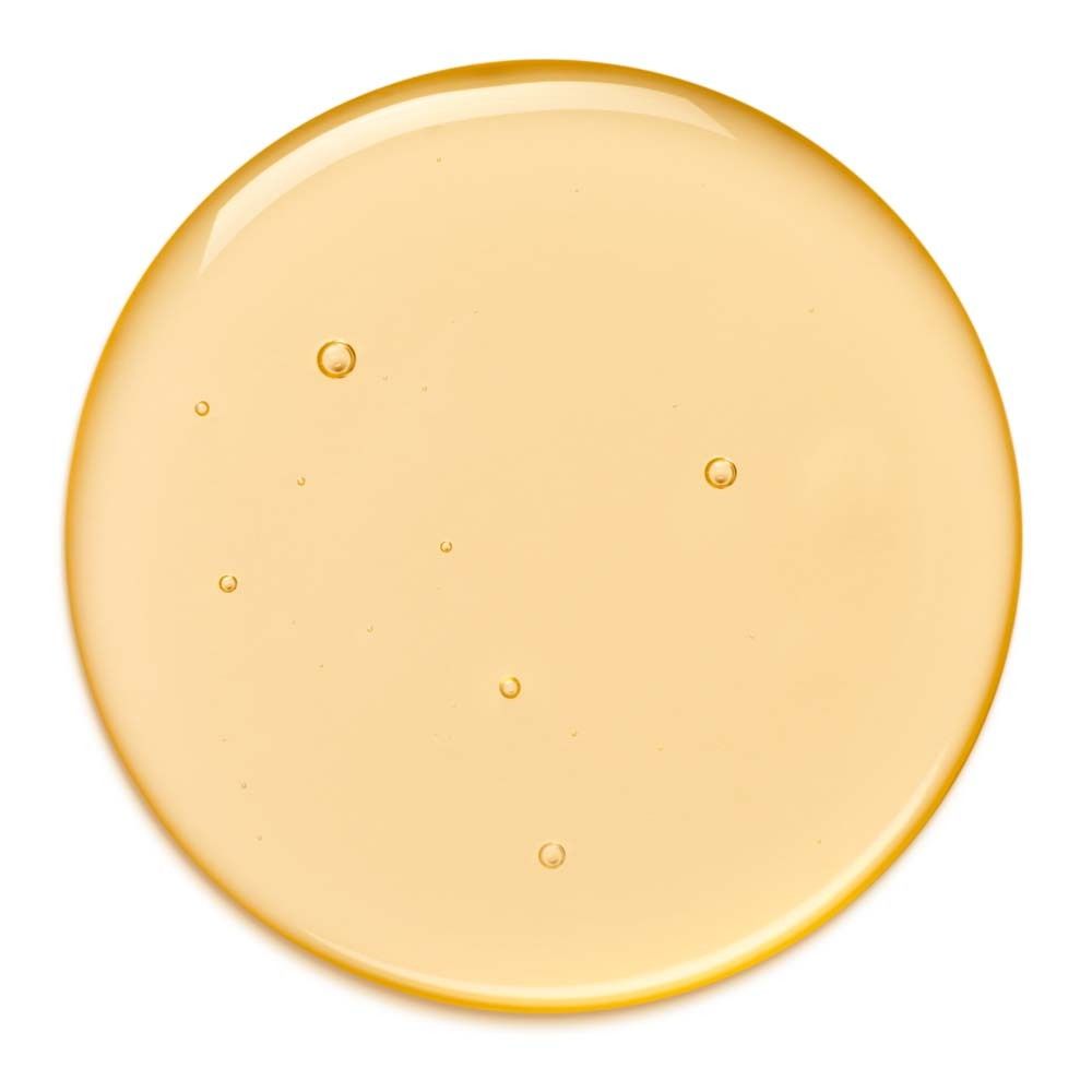 Gelber Öl-Klecks mit kleinen Blasen. Auf weißem Hintergrund.