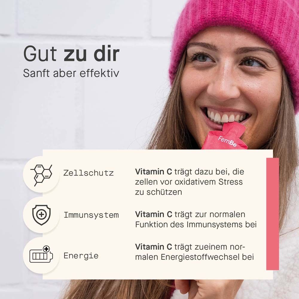 Frau mit Mütze. Text: Vitamin C für Zellschutz, Immunsystem und Energie. Rosa Hintergrund.