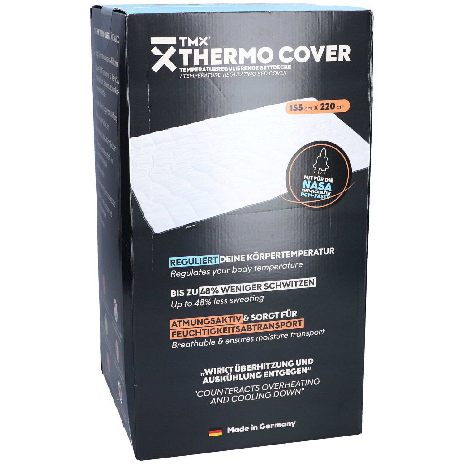 Vorderseite der TMX THERMO COVER-Verpackung. Maße: 155 x 220 cm. Text: Temperaturregulierende Bettdecke. Mit NASA PCM-Faser. Reguliert die Körpertemperatur.