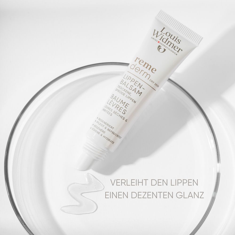 Lippenbalsam-Tube in Glas. Text: Verleiht den Lippen einen dezenten Glanz. Marke: Louis Widmer.
