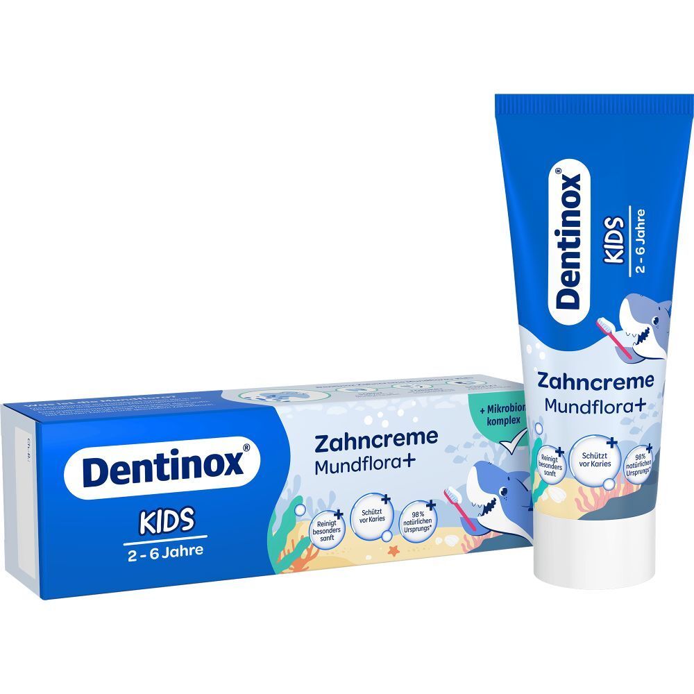 Zahncreme-Tube und -Karton. Blau, mit "Dentinox KIDS" und "Zahncreme Mundflora+". Tube neben Karton.