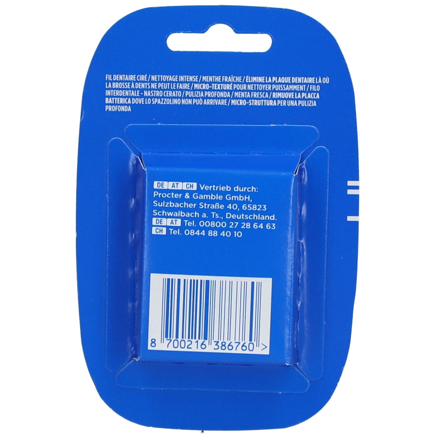 Rückseite der Zahnseide-Packung. Blaue Verpackung mit Text und Barcode. Herstellerinformationen.