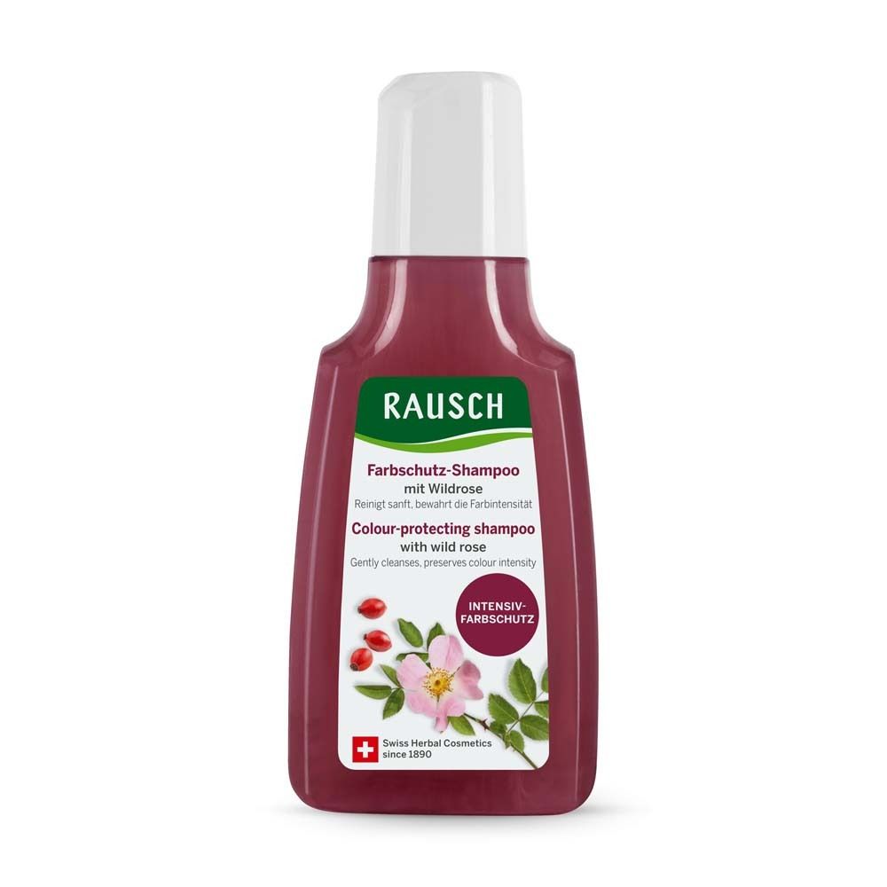 Flasche Farbschutz-Shampoo mit Wildrose. Rote Flüssigkeit, weißer Deckel. Grün-weißes Etikett mit Produktnamen, Wildrosen-Illustration und Schweizer Kreuz.