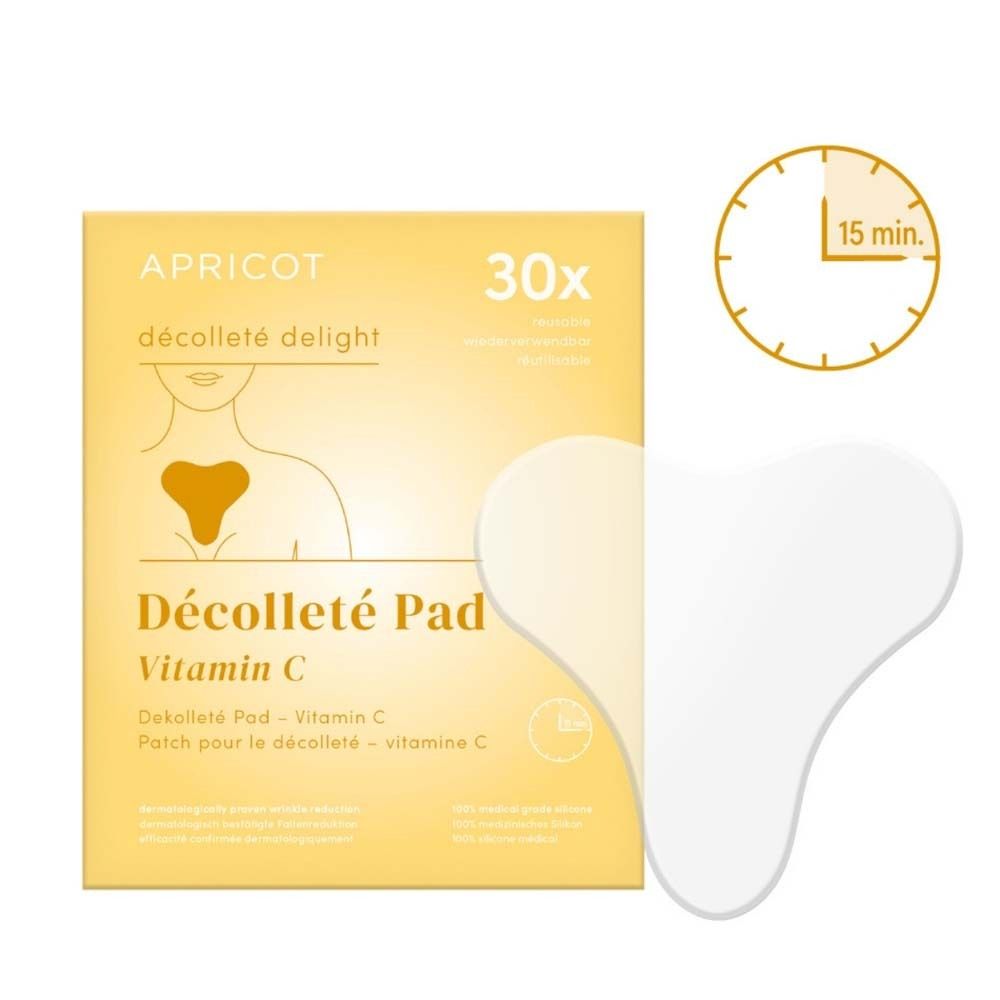 Verpackung mit Dekolleté Pad und Zeituhr. Pad in Herzform, weiß. Verpackung mit Produktnamen und Vitamin C.