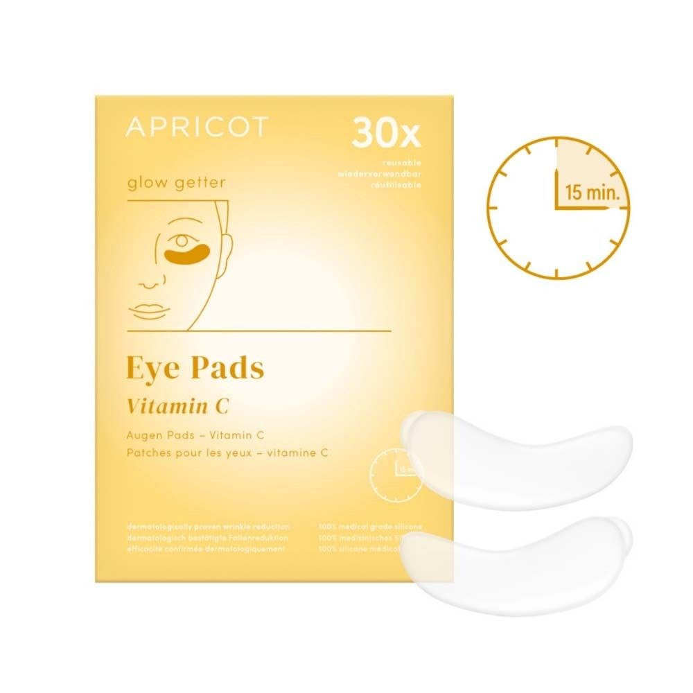 Verpackung mit Augen Pads. Enthält 30 Pads. Aufgedruckt: APRICOT, Eye Pads Vitamin C. Zwei Pads liegen daneben.
