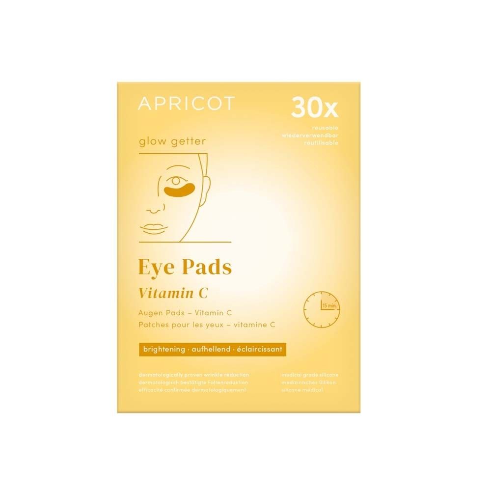 Verpackung mit Augen Pads. Aufgedruckt: APRICOT, Eye Pads Vitamin C. Mit Illustration und Uhr.