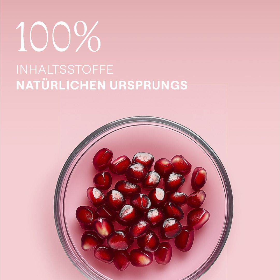Granatapfelkerne in Glasschale auf rosa Hintergrund. Text: 100% Inhaltsstoffe natürlichen Ursprungs.