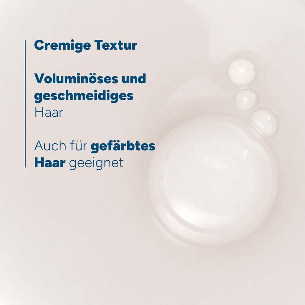 Nahaufnahme von Flüssigkeit. Text: Cremige Textur, Voluminöses und geschmeidiges Haar, Auch für gefärbtes Haar geeignet.