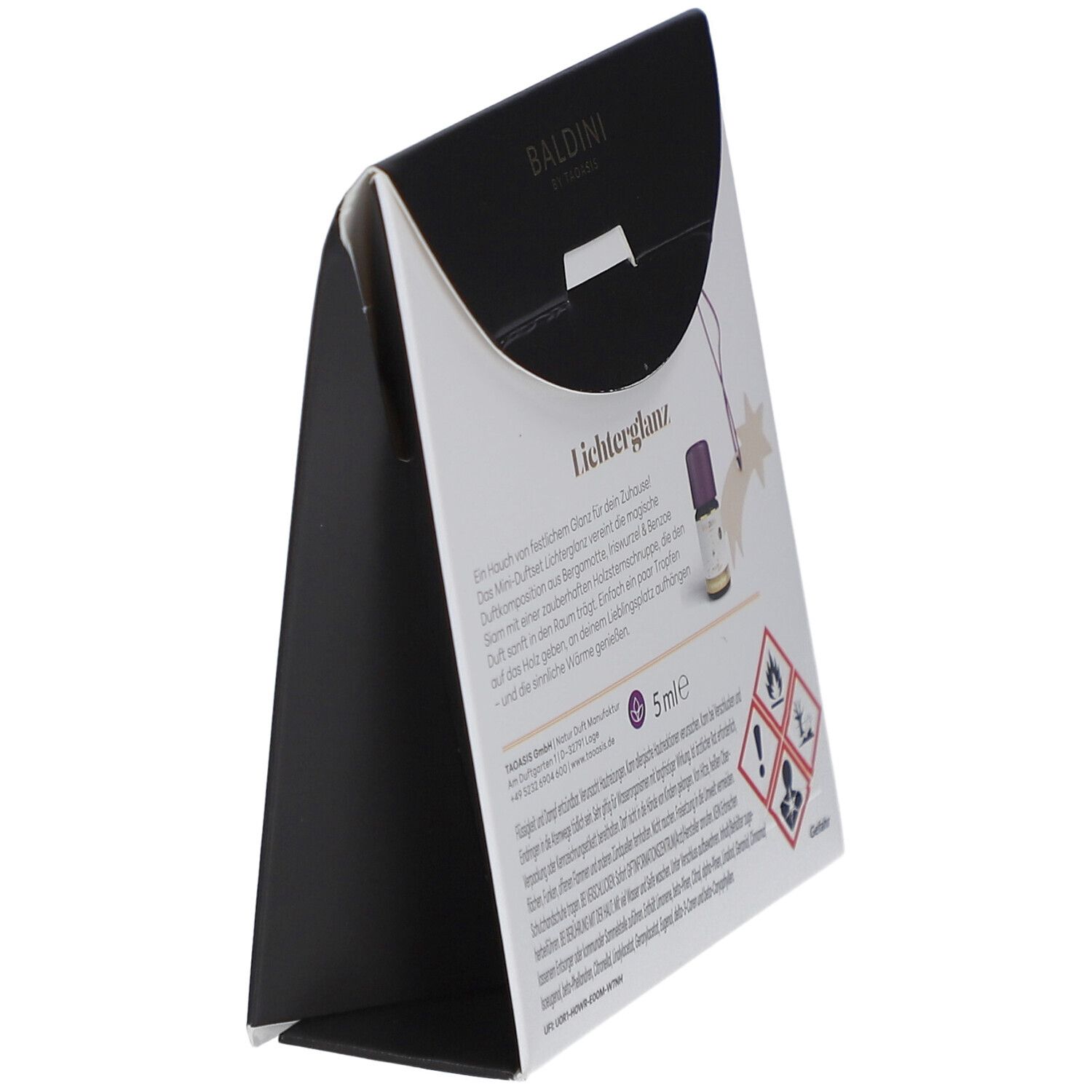 Seitenansicht der Geschenkverpackung. Text: Lichterglanz, 5ml, Warnhinweise. Baldini-Logo und Stern-Dekoration.