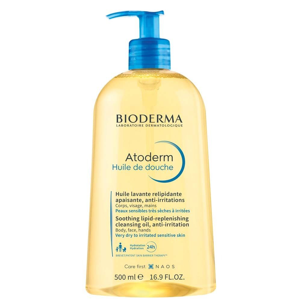 BIODERMA Atoderm Duschöl. Gelbe Flasche mit blauem Pumpkopf. Text: Atoderm, Huile de douche, 24h Feuchtigkeit.