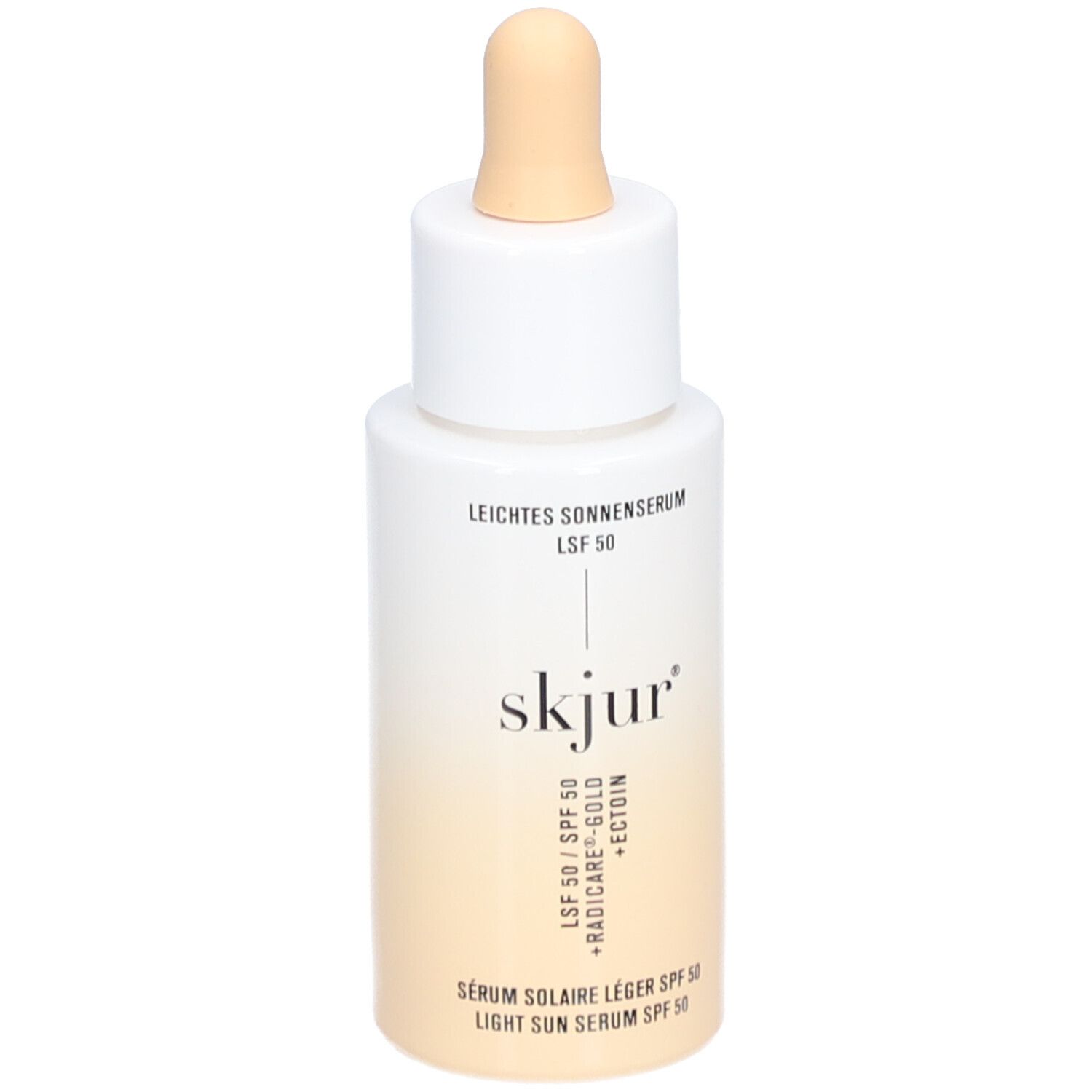 Weiß-beige Flasche mit Pipette. Aufschrift: Leichtes Sonnenserum LSF 50, skjur, Serum solaire léger SPF 50, Light Sun Serum SPF 50.