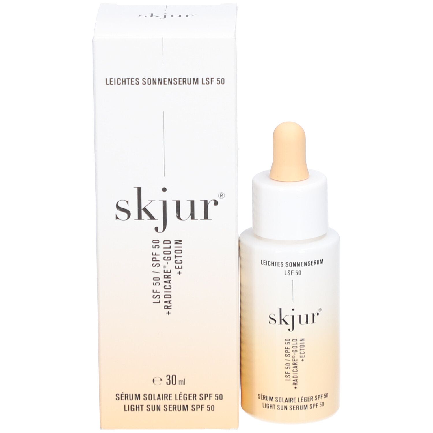 Produkt mit Verpackung. Flasche mit Pipette und Karton. Aufschrift: Leichtes Sonnenserum LSF 50, skjur, 30 ml.