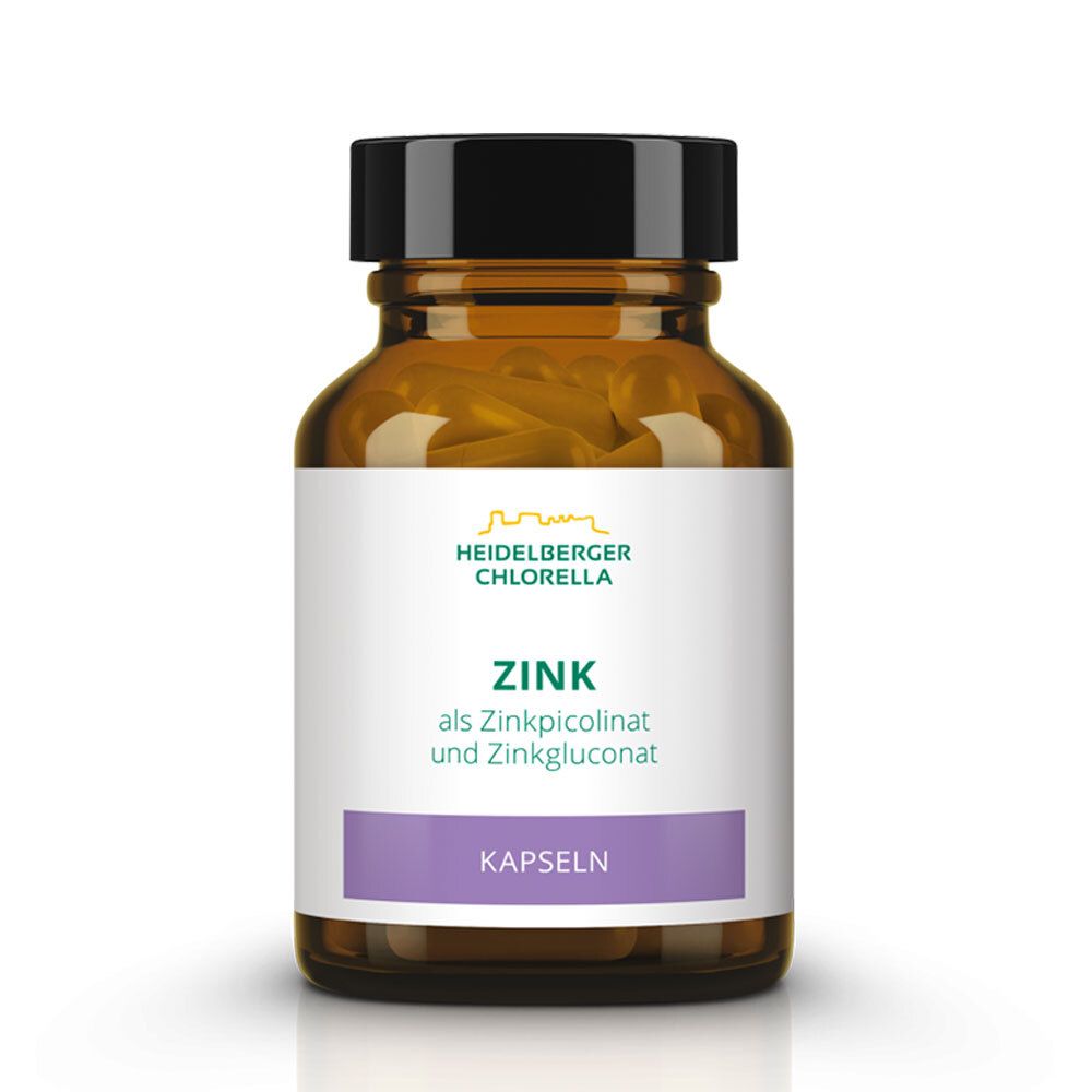 Braune Glasflasche mit Kapseln. Etikett mit "Heidelberger Chlorella", "Zink" und "Kapseln".