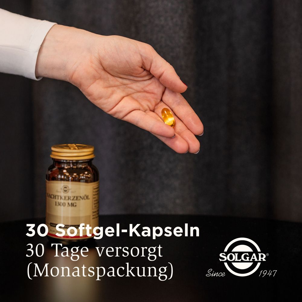 Hand hält eine Kapsel über einer Flasche. Text: 30 Softgel-Kapseln. Monatsverpackung. Marke SOLGAR.