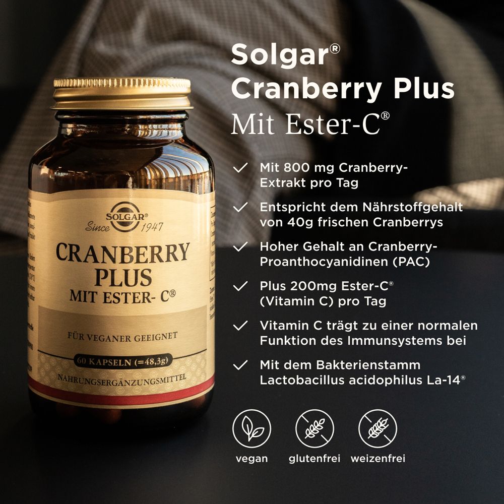 Produktflasche neben Text. Text: Cranberry Plus, Ester-C®, 800mg Cranberry-Extrakt, 200mg Ester-C®, vegan, glutenfrei, weizenfrei.
