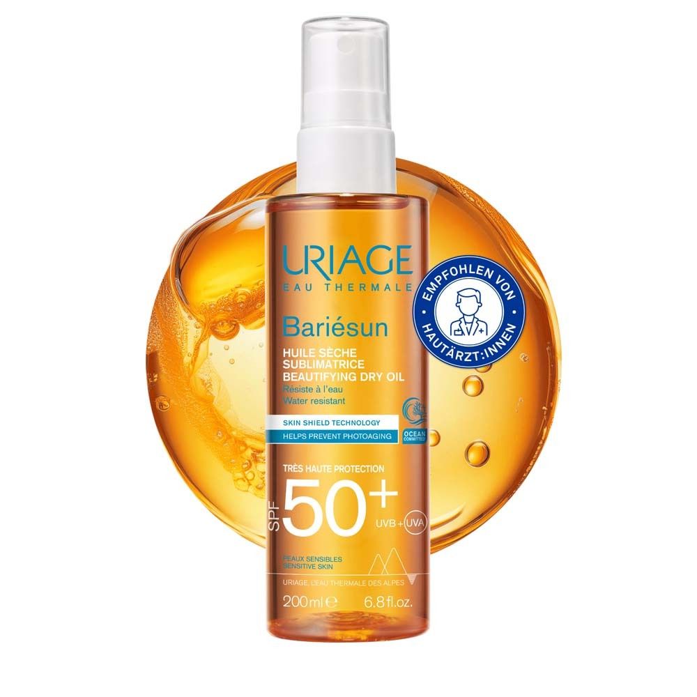 Uriage Bariésun Trockenöl SPF50+ Pump-Spray. Orangefarbene Flasche mit weißem Sprühkopf. Empfohlen von Hautärzten.