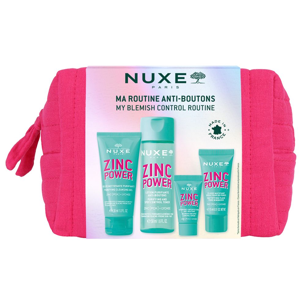 Pinkfarbene Kosmetiktasche mit vier Produkten. Auf der Verpackung steht "NUXE PARIS" und "ZINC POWER".