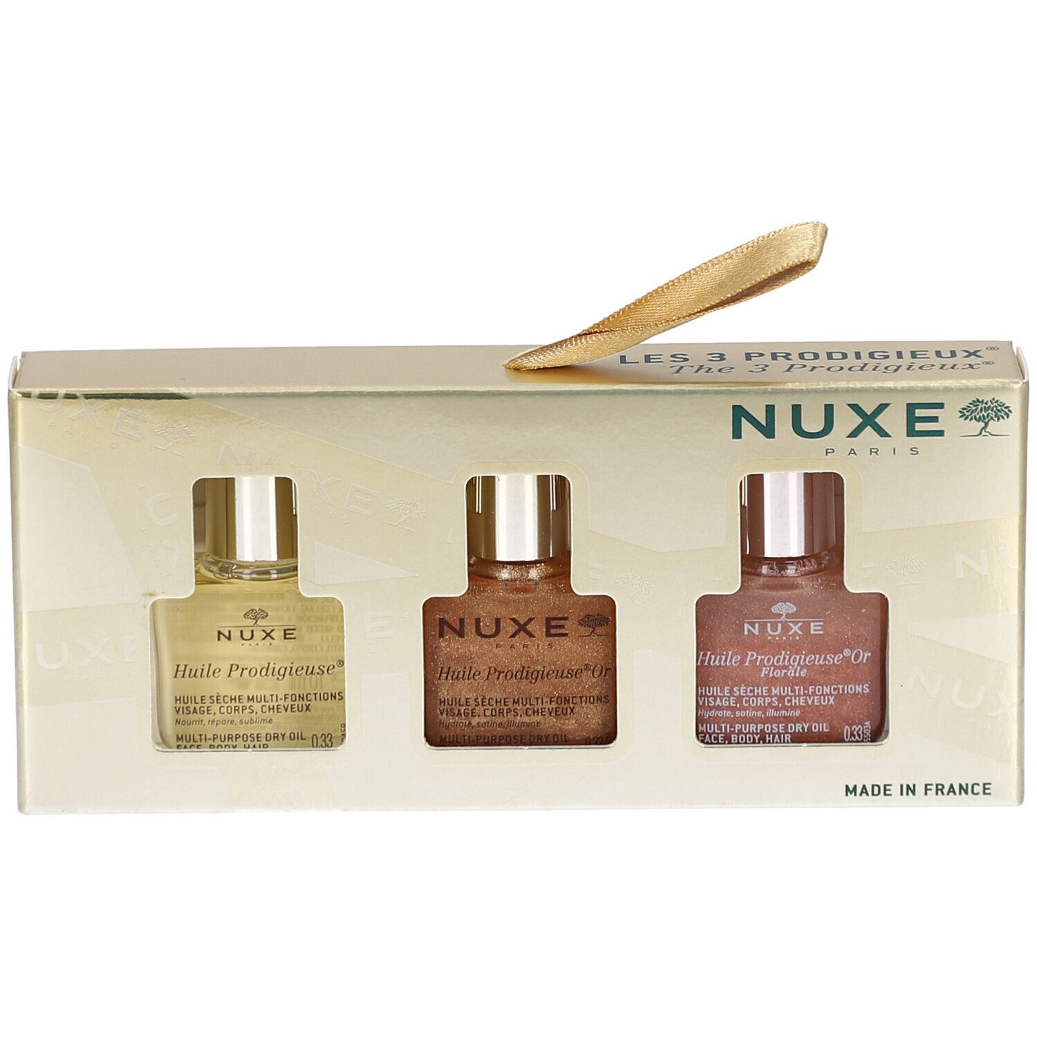 Geschenkset mit drei Ölen. Goldfarbene Verpackung mit Sichtfenstern. NUXE-Logo und Produktnamen sichtbar.