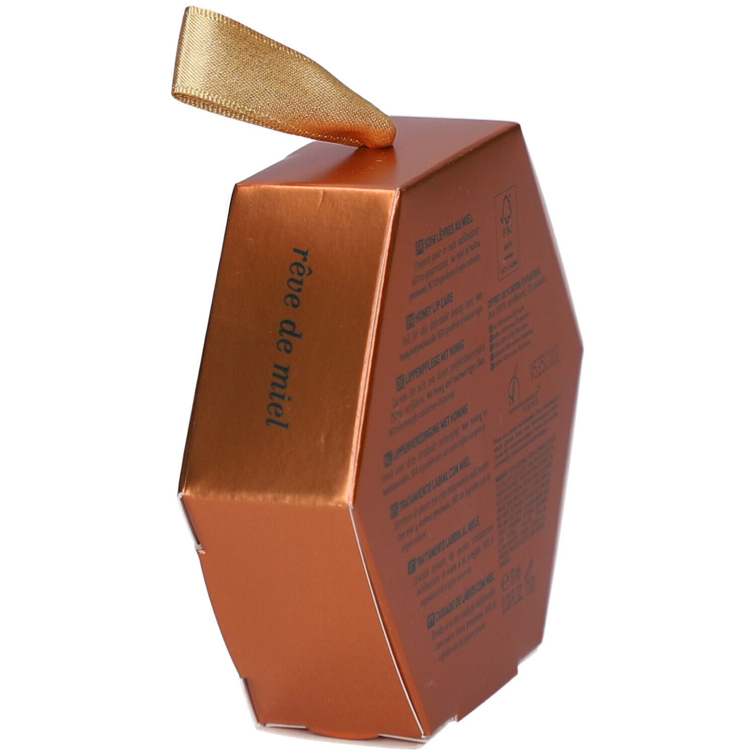 Goldfarbene, sechseckige Verpackung. Aufschrift 'rêve de miel'. Schleife zum Aufhängen.