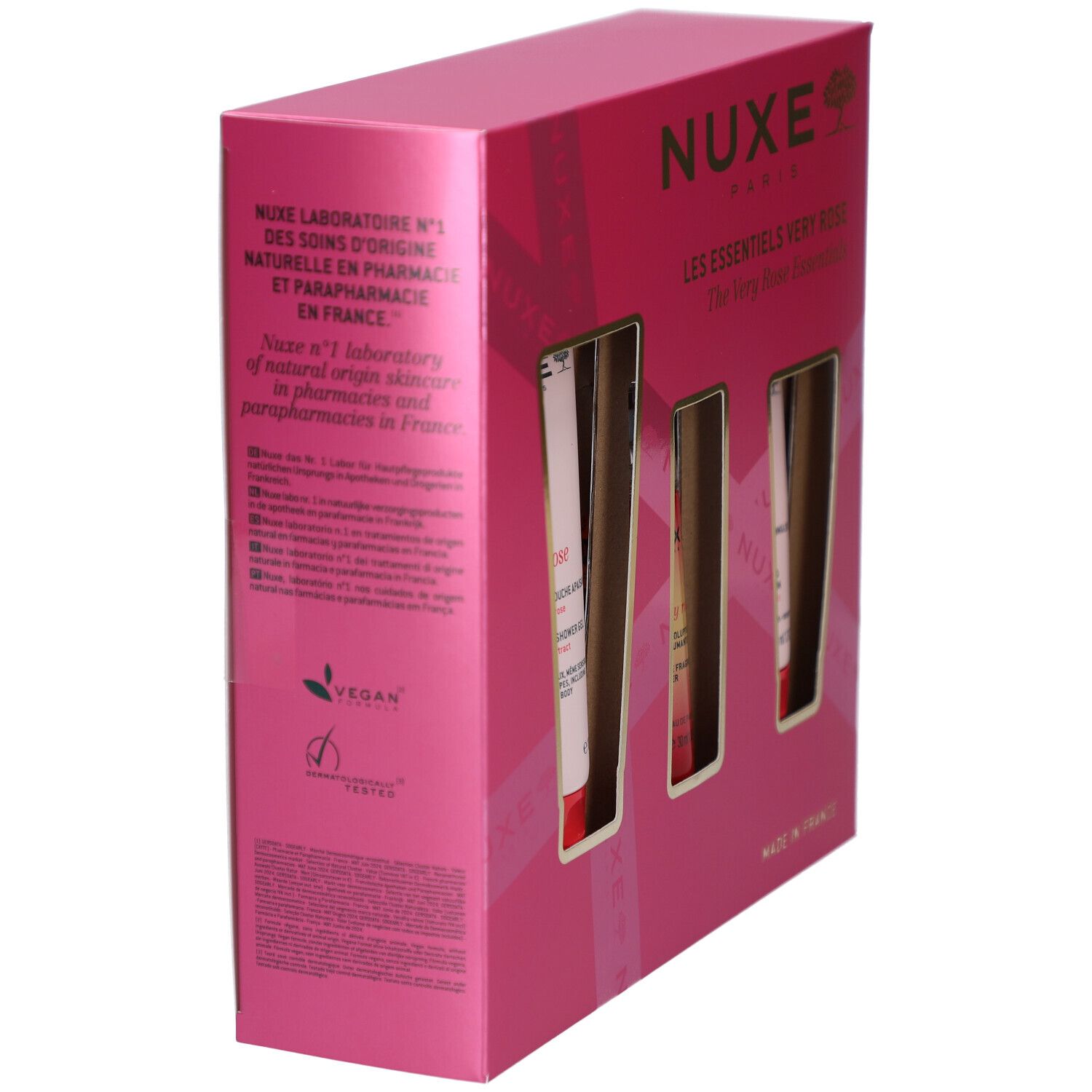 Rosa Geschenkbox, Seitenansicht. Text über NUXE-Labor und Inhaltsstoffe. Vegan-Logo und "Dermatologisch getestet".