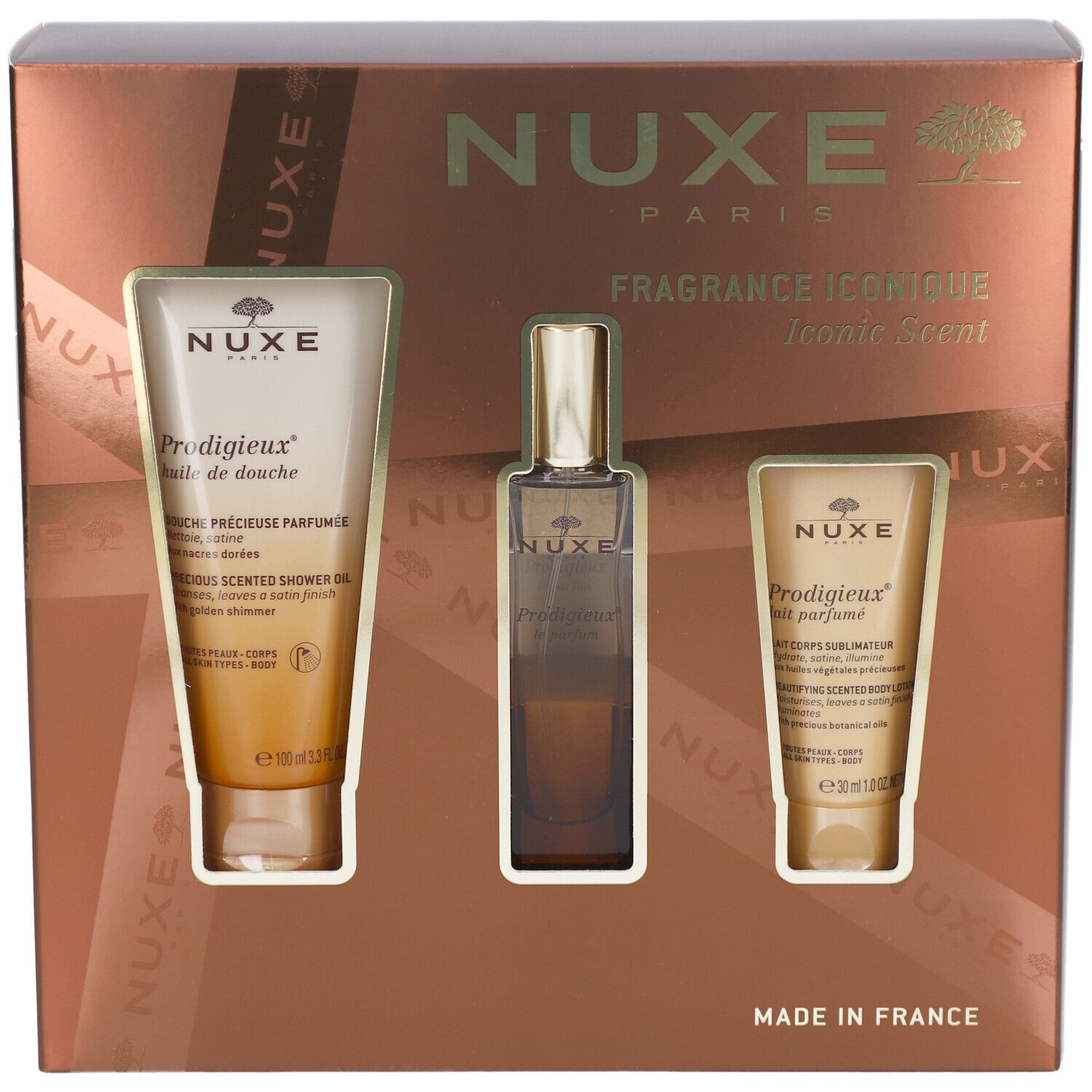 Geschenkset mit drei Produkten in einer braunen Schachtel. Enthält eine Duschcreme, ein Parfum und eine Körperlotion. NUXE-Logo.