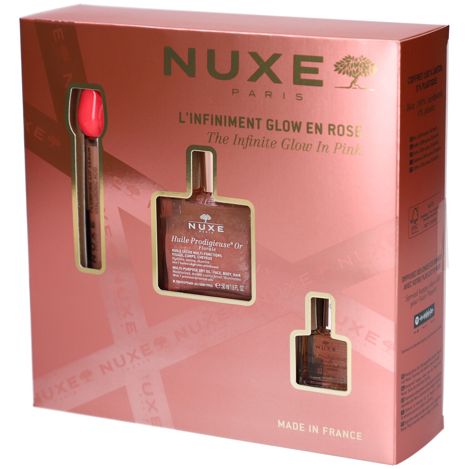 Geschenkset mit drei Produkten in rosa Verpackung. Enthält eine Flasche, eine kleine Flasche und einen Applikator. Marke NUXE.