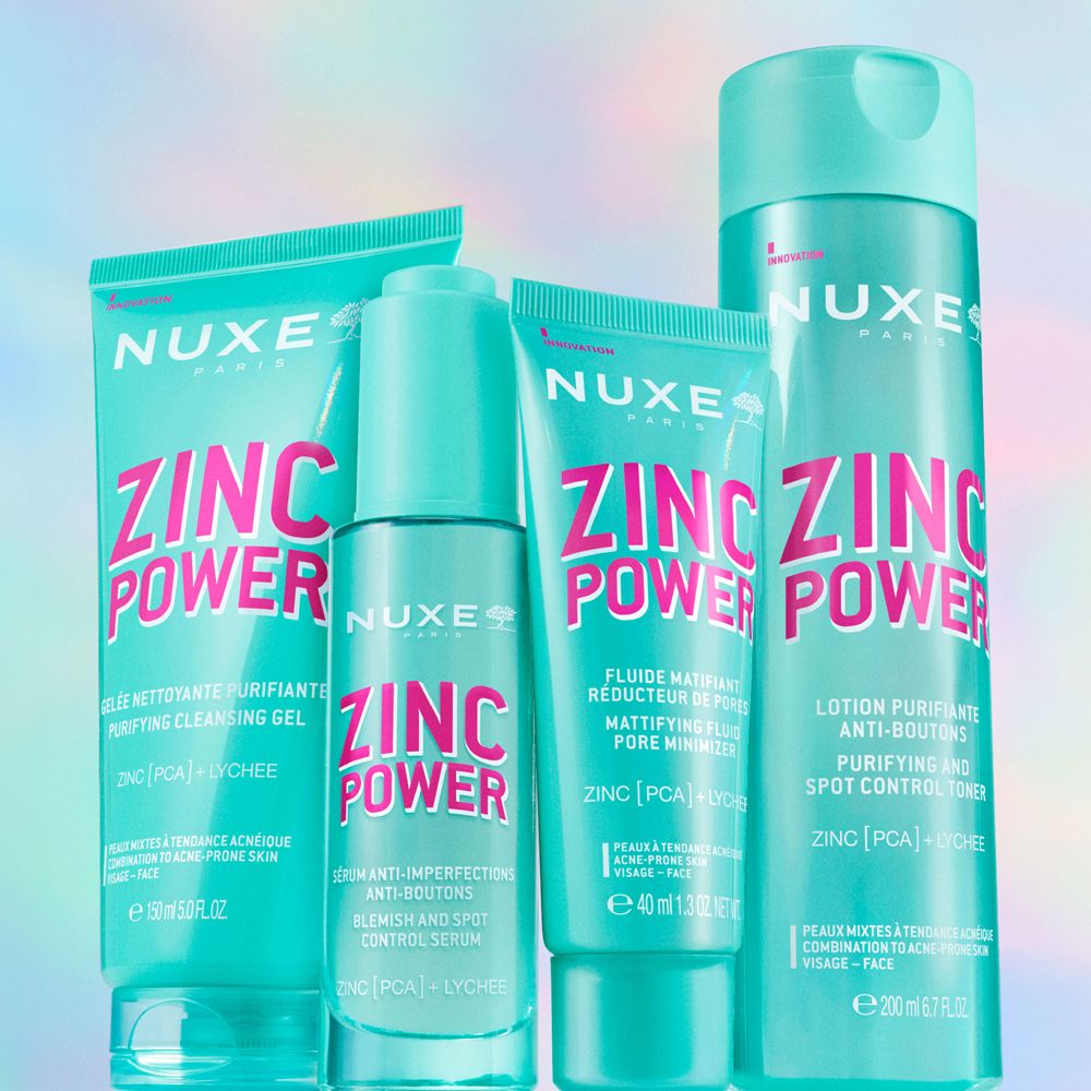 Vier NUXE ZINC POWER Produkte: Reinigungsgel, Serum, mattierende Fluid, Lotion. Türkis, rosa Schrift.