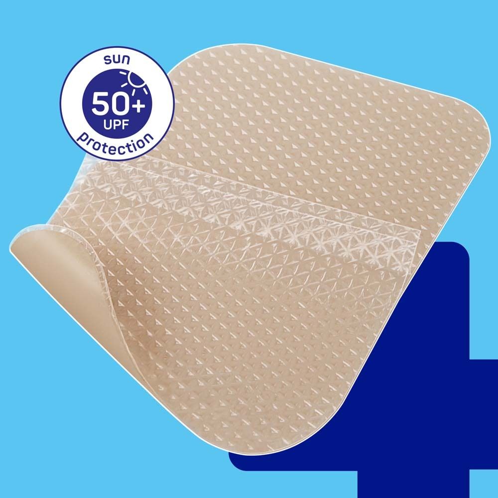 Beige Narbenpflaster mit 50+ UV-Schutz-Siegel. Oberseite strukturiert.