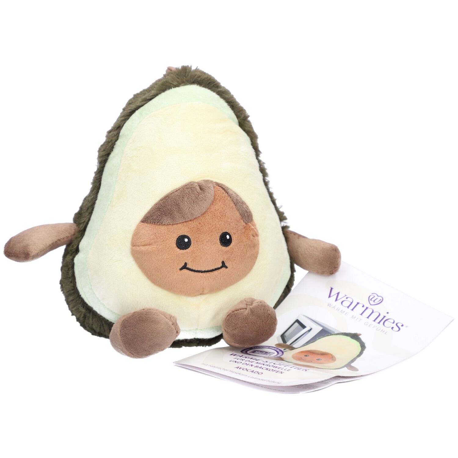 Plüsch-Avocado mit Gesicht und Gliedmaßen. Beiliegend ein Etikett mit dem Markennamen Warmies.