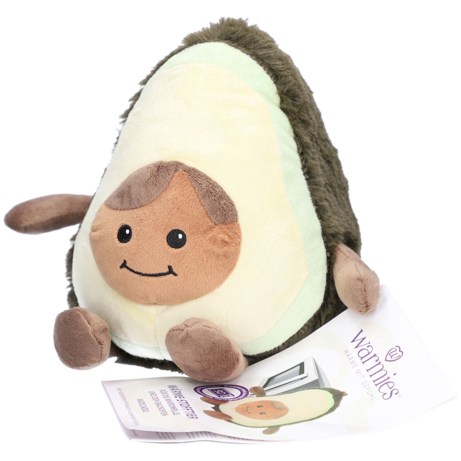 Plüsch-Avocado mit Gesicht und Gliedmaßen. Beiliegend ein Etikett mit dem Markennamen Warmies.