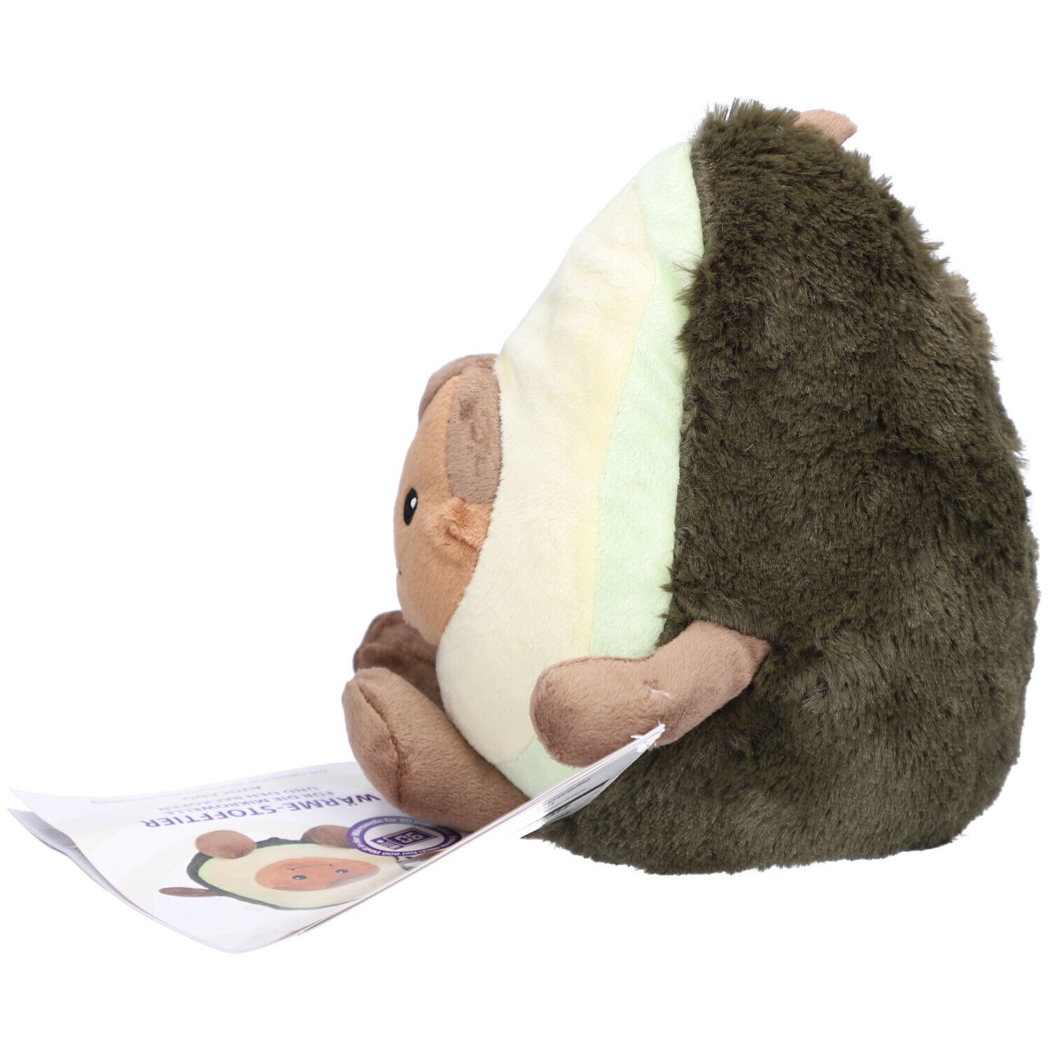 Seitenansicht einer Avocado-Plüschfigur. Das Produkt hat Arme und Beine. Ein Etikett liegt daneben.
