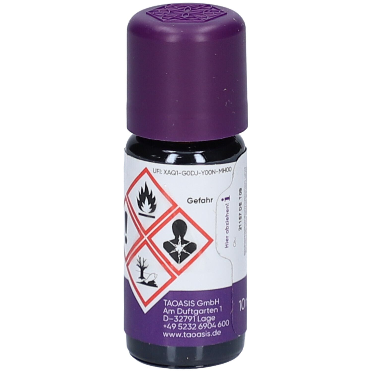 Braune Glasflasche mit lila Deckel. Gefahrensymbole auf dem Etikett. Marke: TAOASIS.