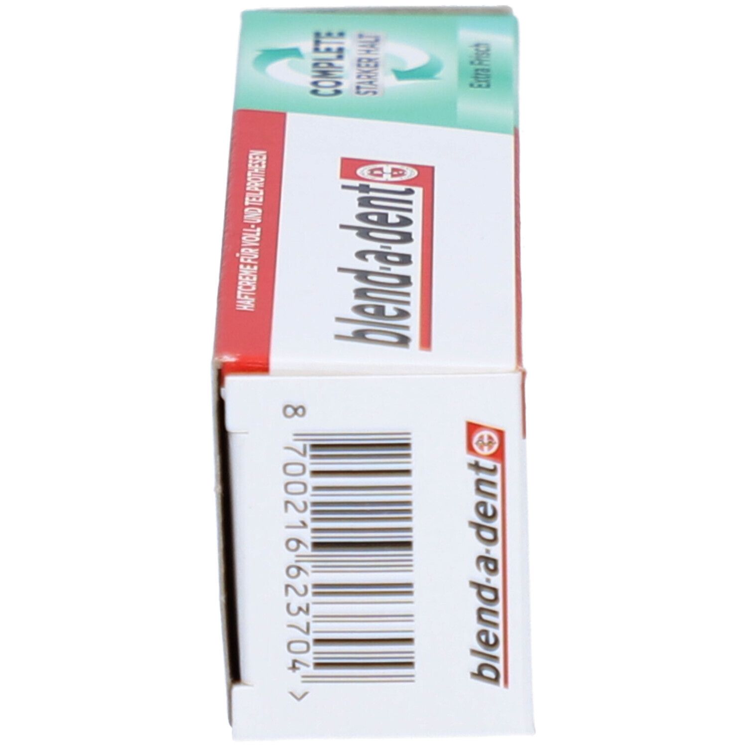 Schachtel für Zahnprothesen-Haftcreme. Weiß, grün-rot. Marke: blend-a-dent. Barcode und Produktinformationen.