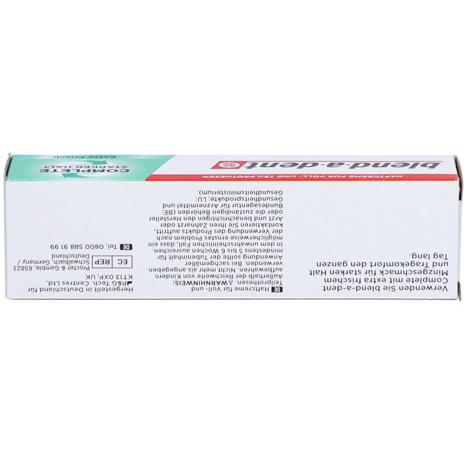 Schachtel für Zahnprothesen-Haftcreme. Weiß, grün-rot. Marke: blend-a-dent. Text und Warnhinweise.