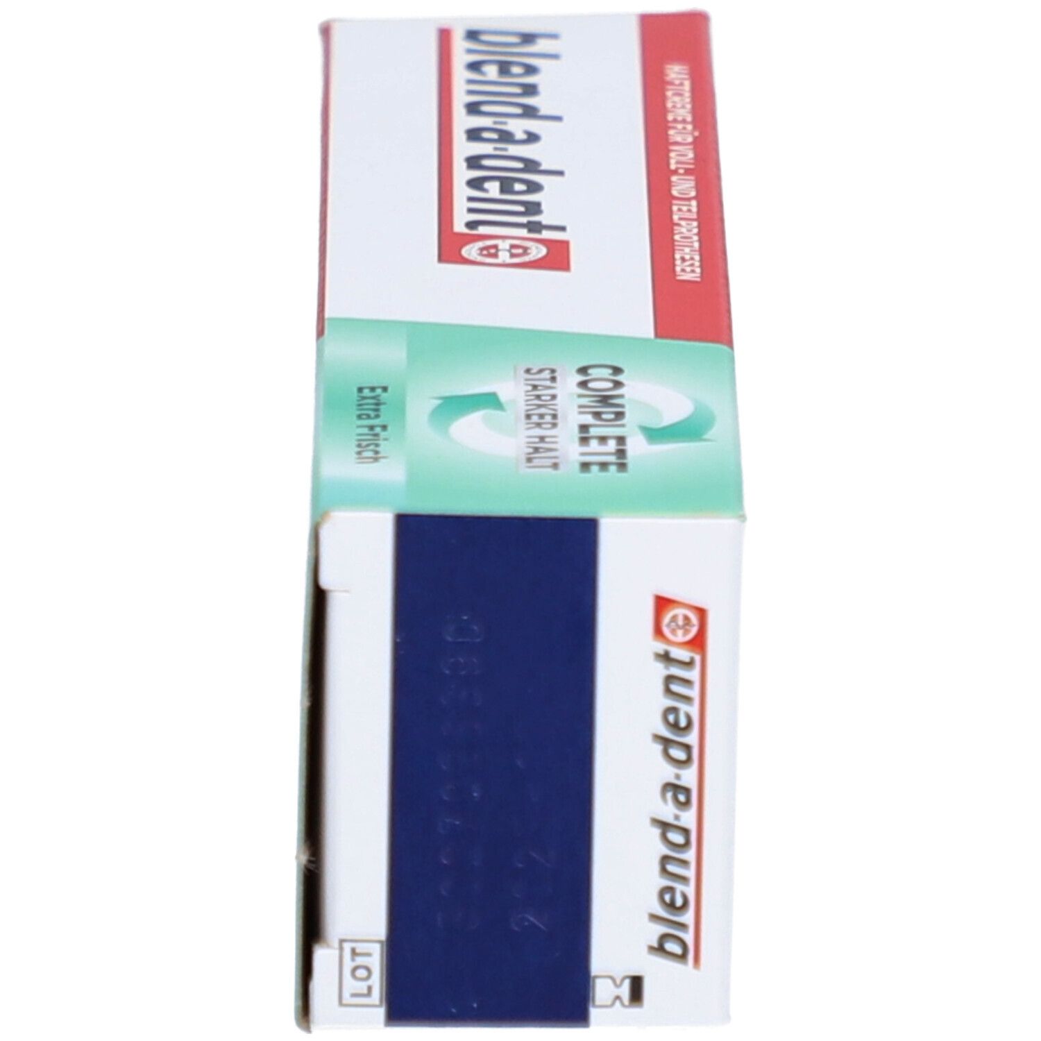 Schachtel für Zahnprothesen-Haftcreme. Weiß, grün-rot. Marke: blend-a-dent. Aufschrift: COMPLETE, Extra Frisch, Starker Halt.