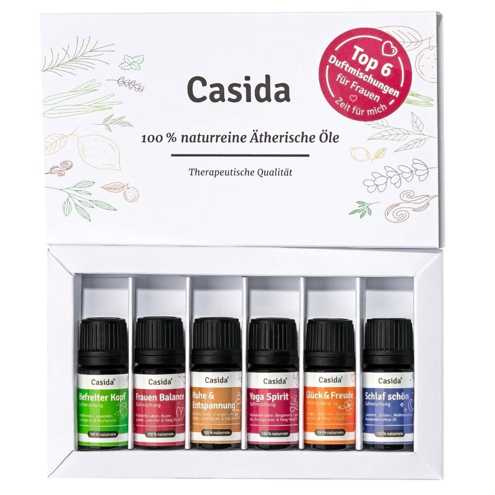 Weißer Karton mit sechs kleinen Flaschen ätherischer Öle. Aufschrift: Casida, 100% naturreine ätherische Öle. Top 6 für Frauen.