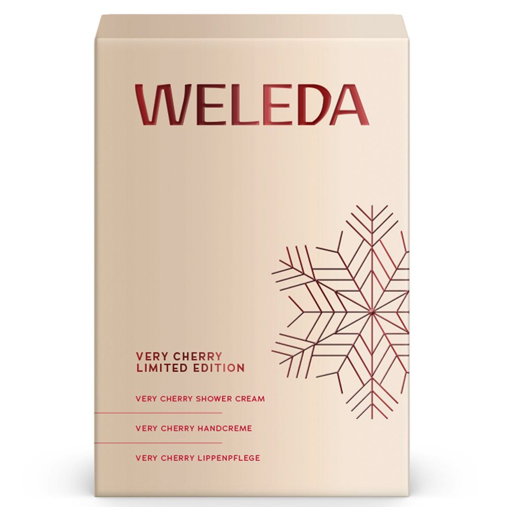 Beige Geschenkbox mit rotem Schriftzug Weleda und Schneeflocken-Design. Enthält Produkte der Very Cherry Limited Edition.