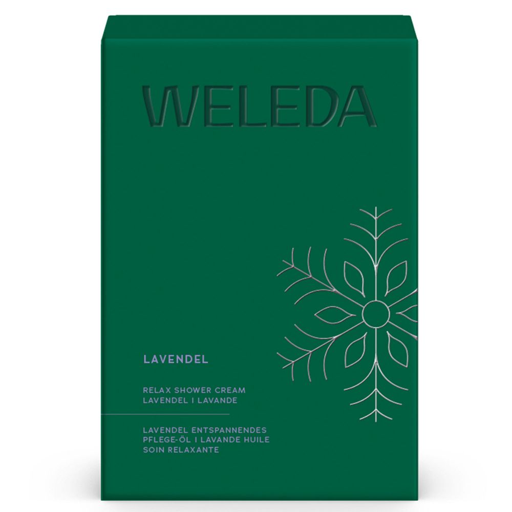 Grüne Geschenkbox mit Prägung WELEDA und Lavendel-Schriftzug. Schneeflocken-Design.