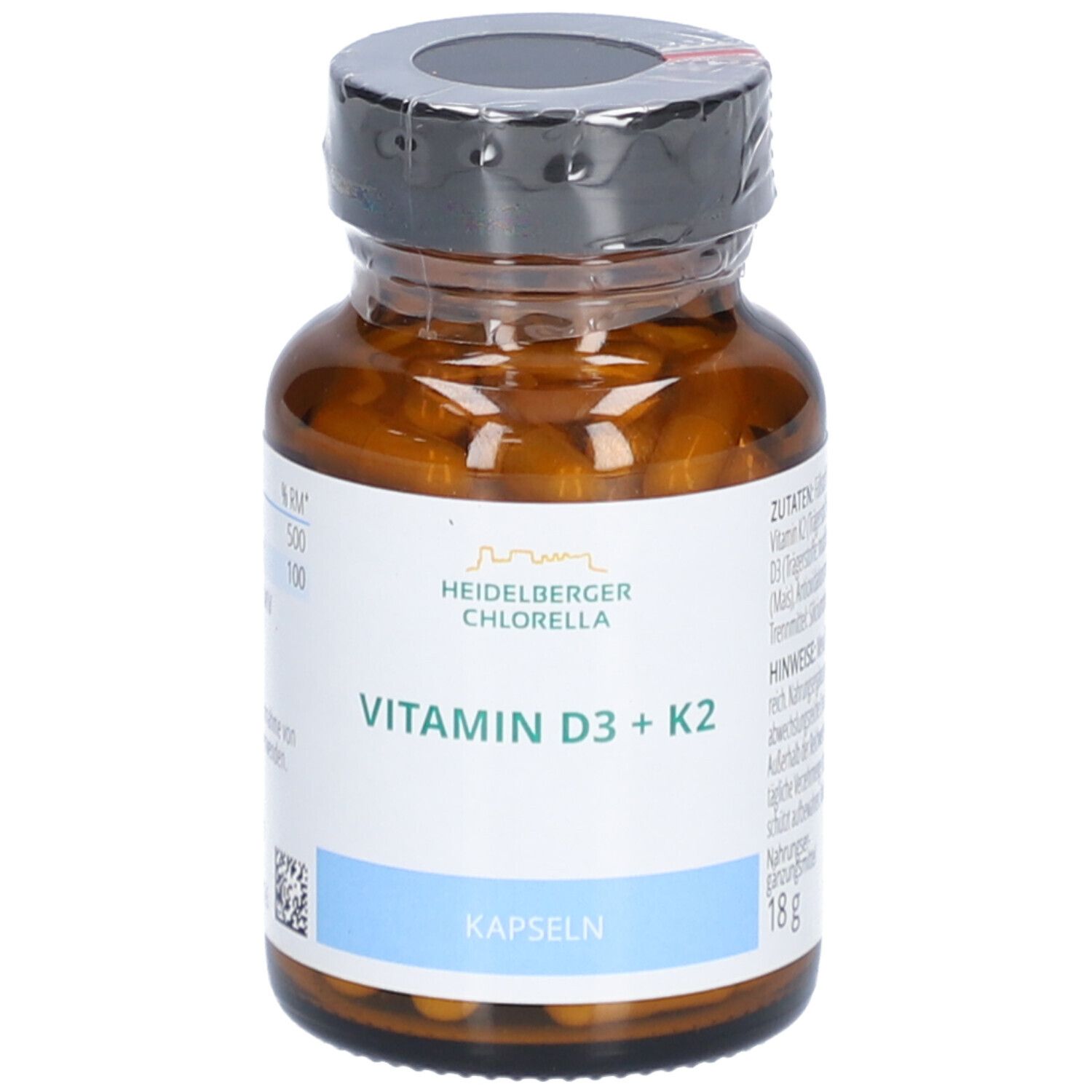 Braune Glasflasche mit Kapseln. Aufschrift: Vitamin D3 + K2, Kapseln, Heidelberger Chlorella.